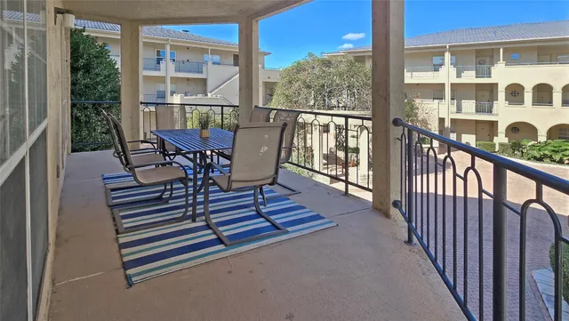 a view of a two chairs in the balcony