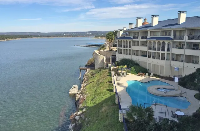 a balcony with table and chairs