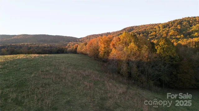 a view of a large mountain with mountains in the background