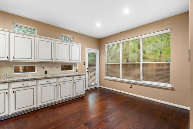 a large kitchen with cabinets