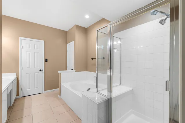 a bathroom with a bathtub and a shower