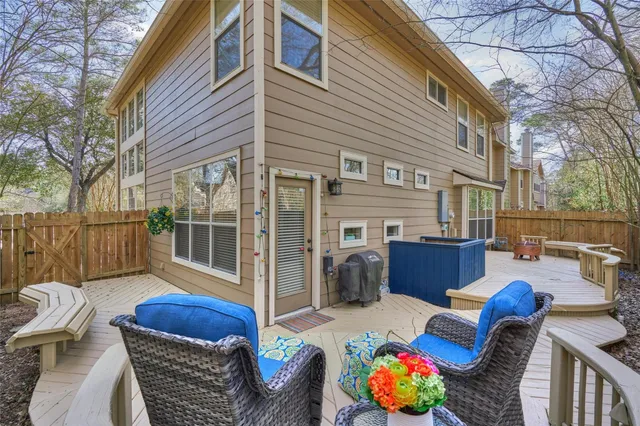 a view of a patio with couches chairs and a fire pit