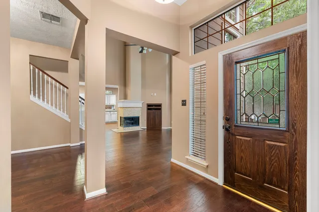a view of an entryway with wooden floor