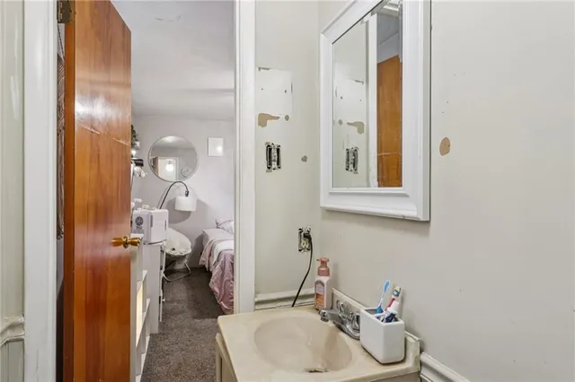 a bathroom with a sink and a mirror