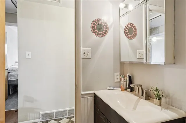 a bathroom with a sink and a mirror