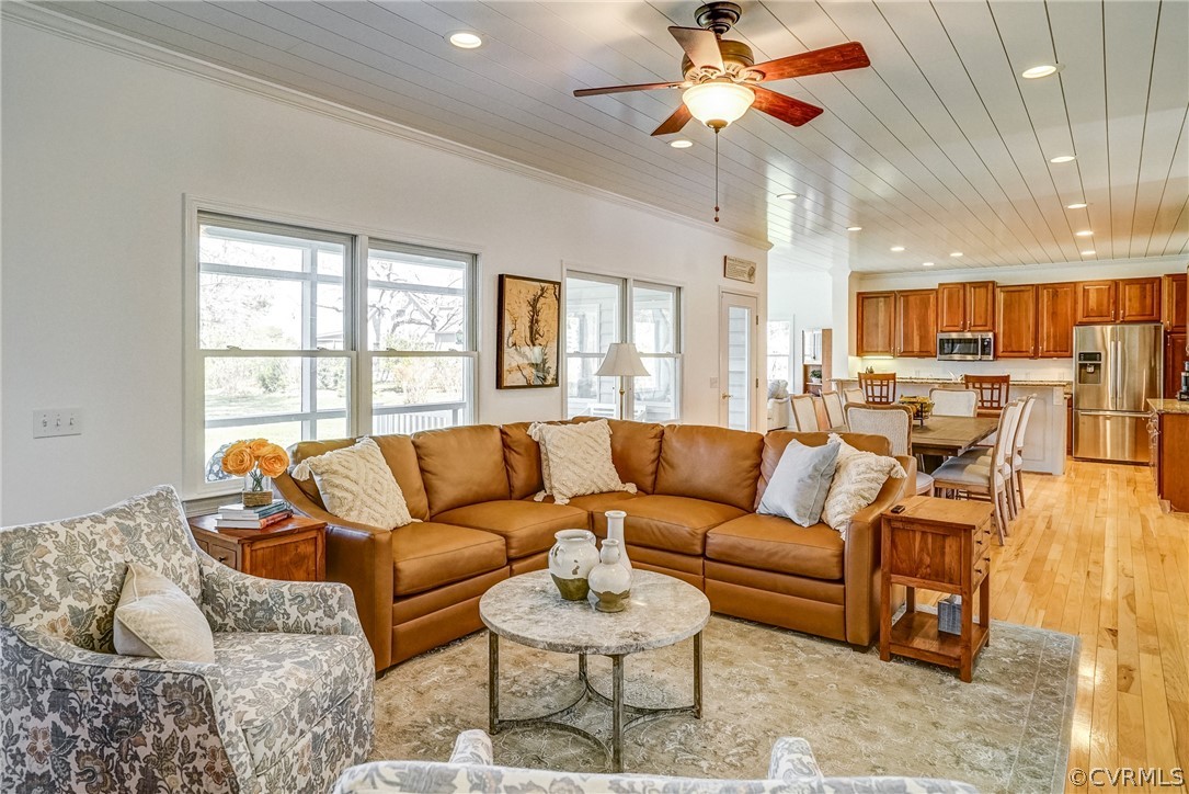 253 Prentice Point Drive Kilmarnock, VA 22482 - Photo 12 of 44 a living room with furniture and a large window