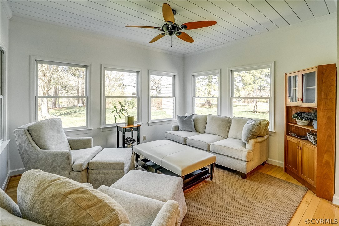 253 Prentice Point Drive Kilmarnock, VA 22482 - Photo 18 of 44 a living room with furniture ceiling fan and a window