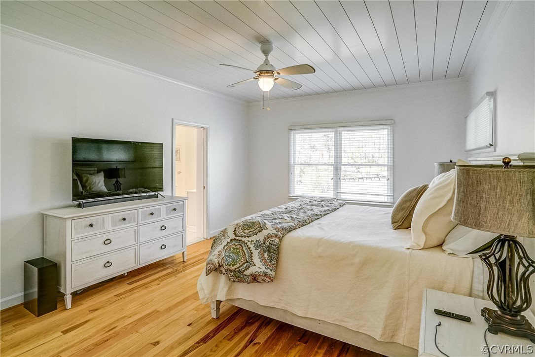 253 Prentice Point Drive Kilmarnock, VA 22482 - Photo 20 of 44 a bedroom with a bed and a flat screen tv