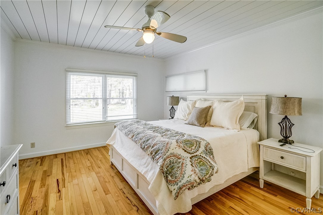253 Prentice Point Drive Kilmarnock, VA 22482 - Photo 21 of 44 a bedroom with a bed and a window
