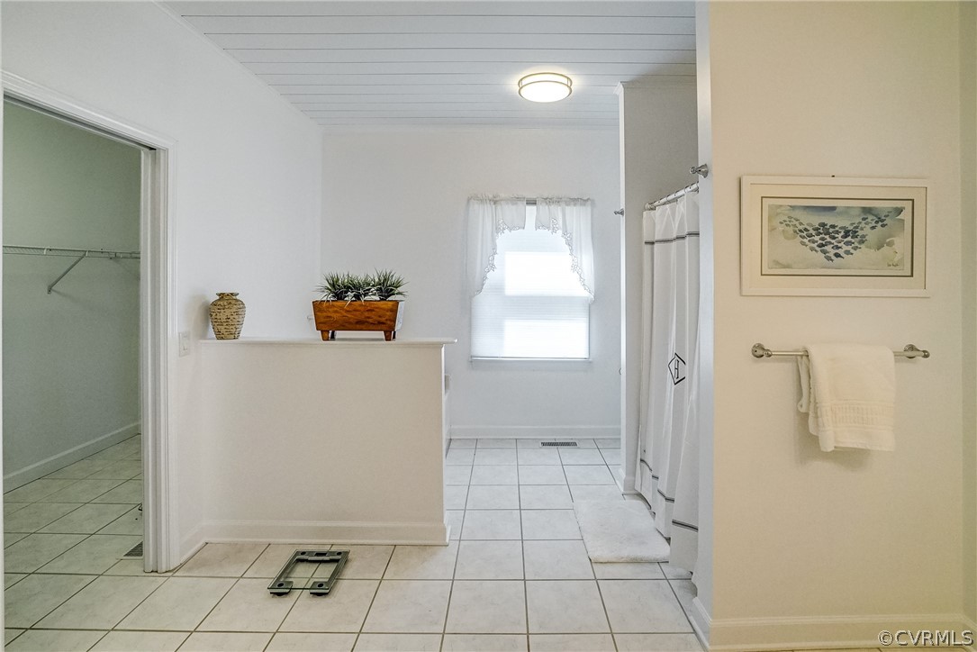 253 Prentice Point Drive Kilmarnock, VA 22482 - Photo 22 of 44 a room with a walk in closet and mirror