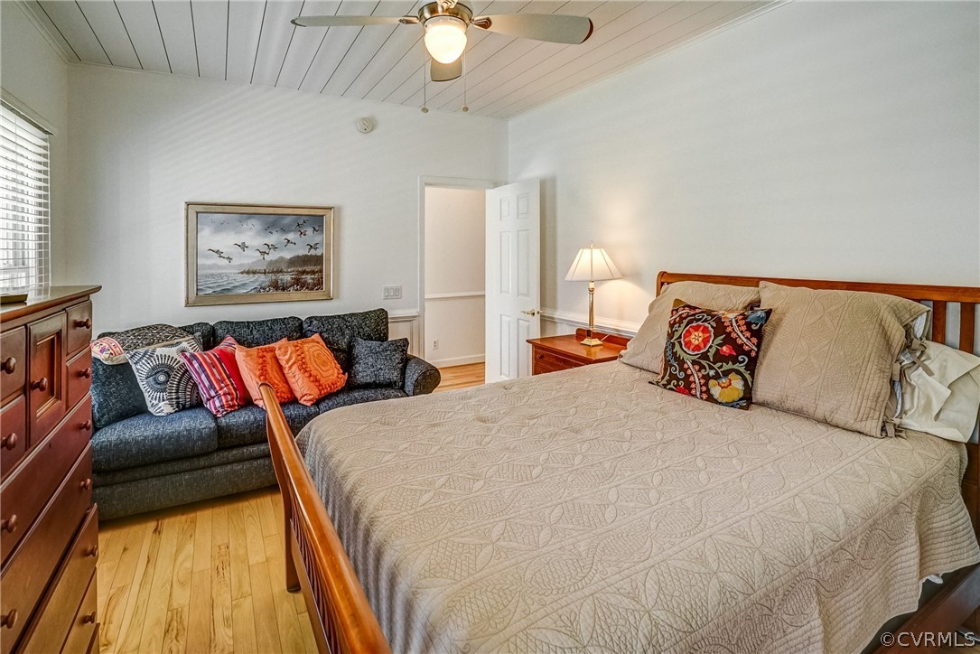 253 Prentice Point Drive Kilmarnock, VA 22482 - Photo 26 of 44 a bedroom with a bed and a couch