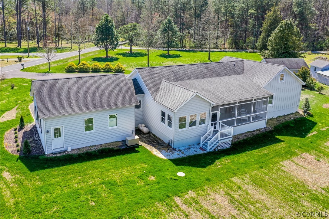253 Prentice Point Drive Kilmarnock, VA 22482 - Photo 42 of 44 a aerial view of a house with a big yard and large trees