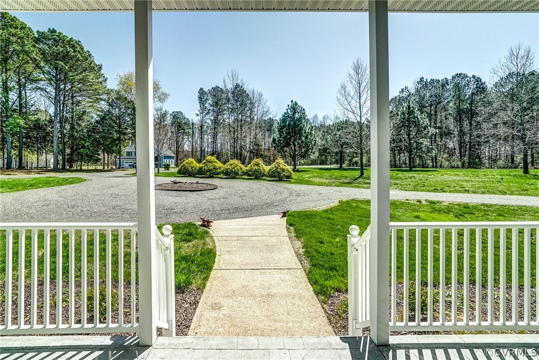 253 Prentice Point Drive Kilmarnock, VA 22482 - Photo 7 of 44 a view of a porch with a yard