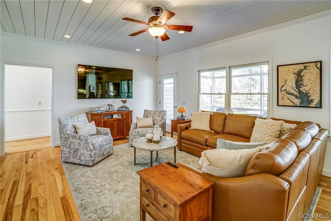 253 Prentice Point Drive Kilmarnock, VA 22482 - Photo 10 of 44 a living room with furniture and a flat screen tv