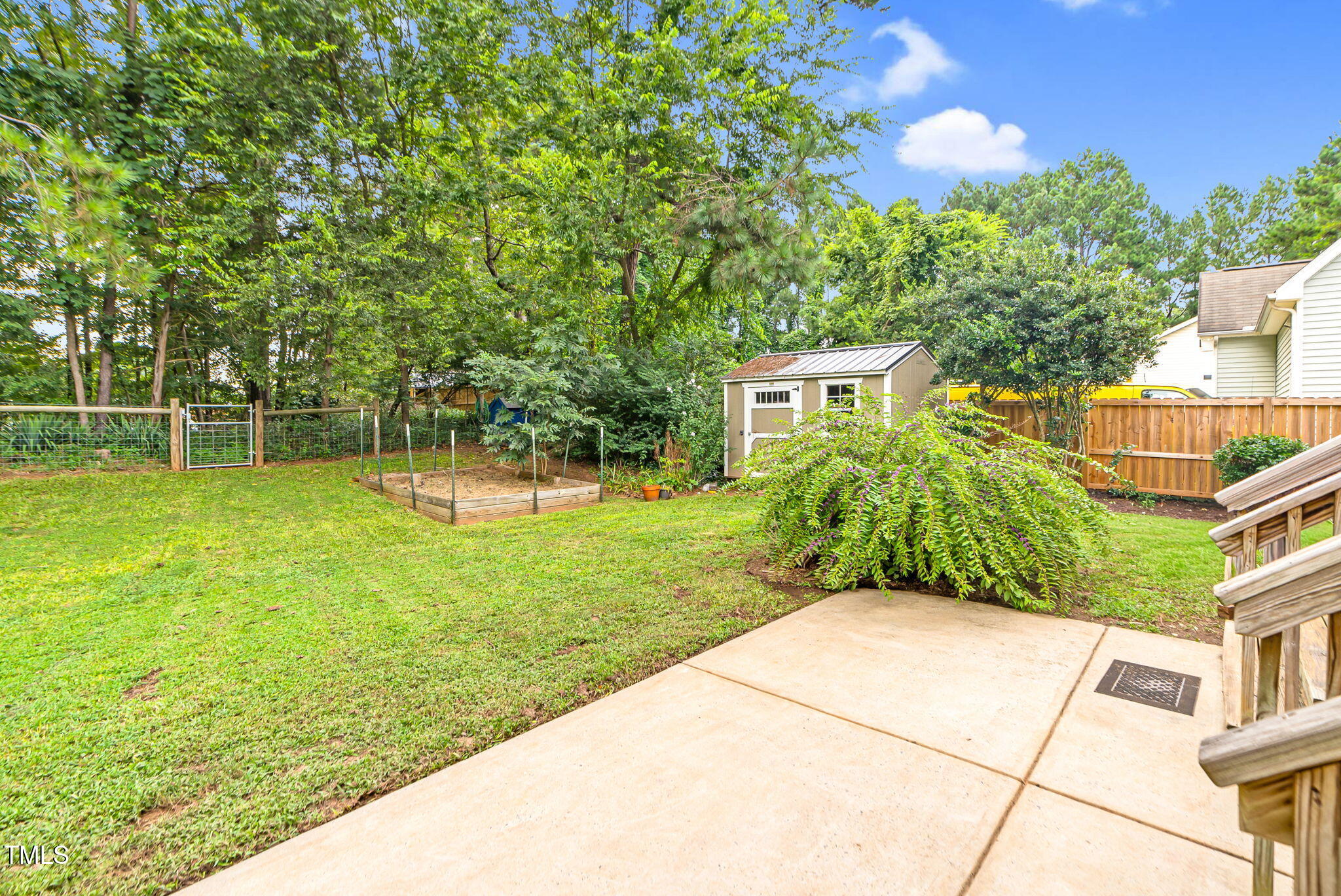 243 Toomer Loop Road Pittsboro, NC 27312 - Photo 16 of 42 a view of a backyard with a garden