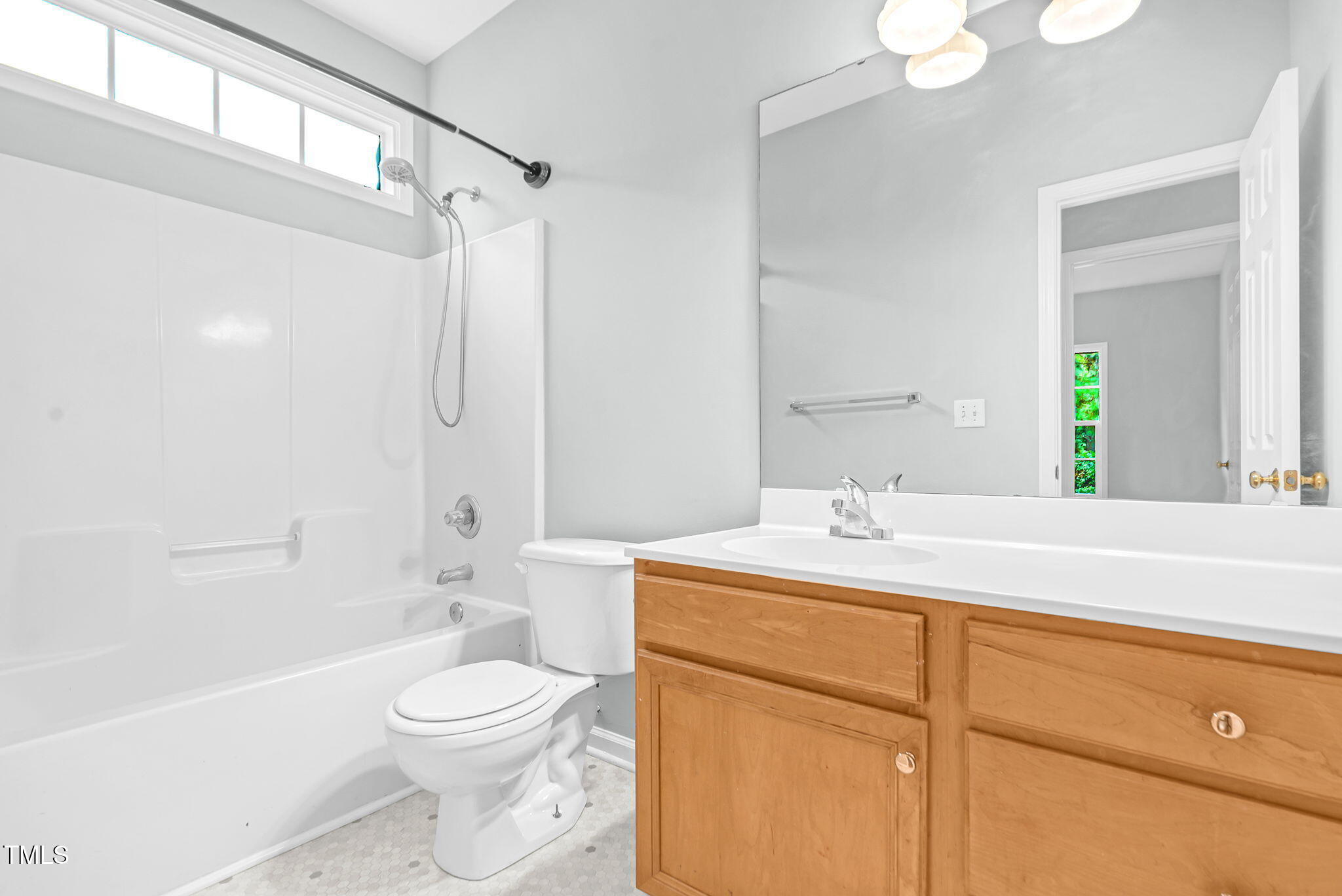 243 Toomer Loop Road Pittsboro, NC 27312 - Photo 24 of 42 a bathroom with a sink a toilet and shower