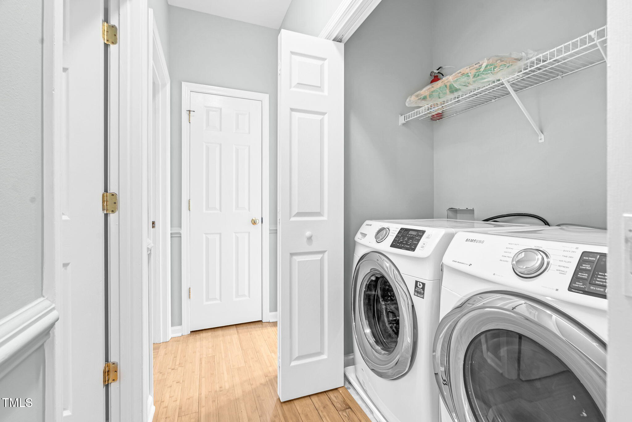 243 Toomer Loop Road Pittsboro, NC 27312 - Photo 30 of 42 a utility room with dryer and washer