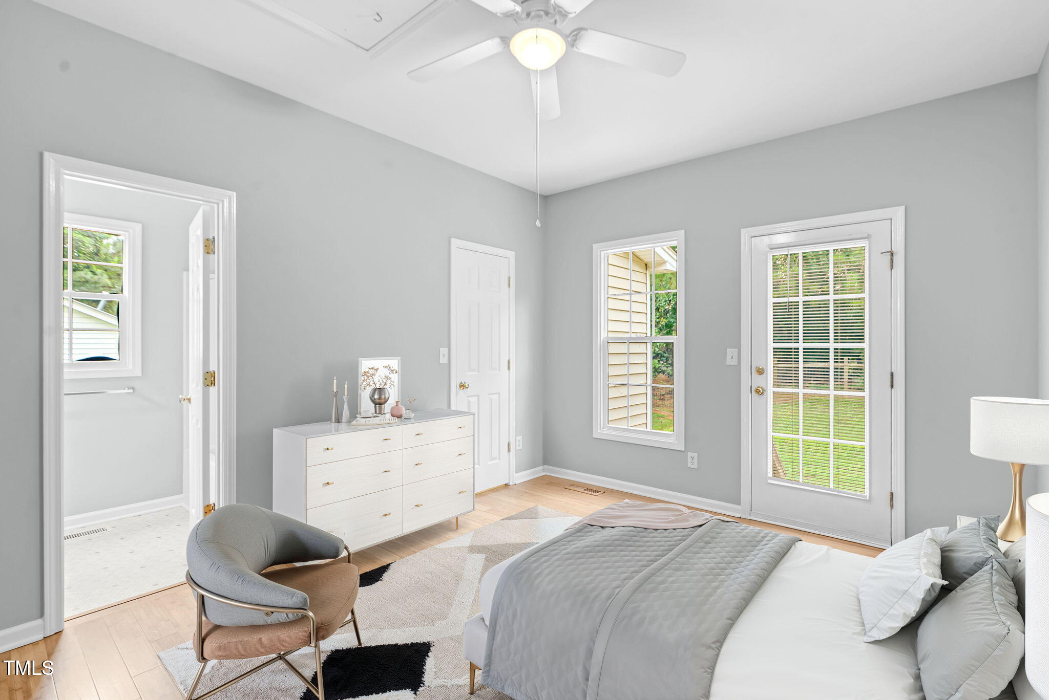243 Toomer Loop Road Pittsboro, NC 27312 - Photo 31 of 42 a bedroom with a bed and a chandelier