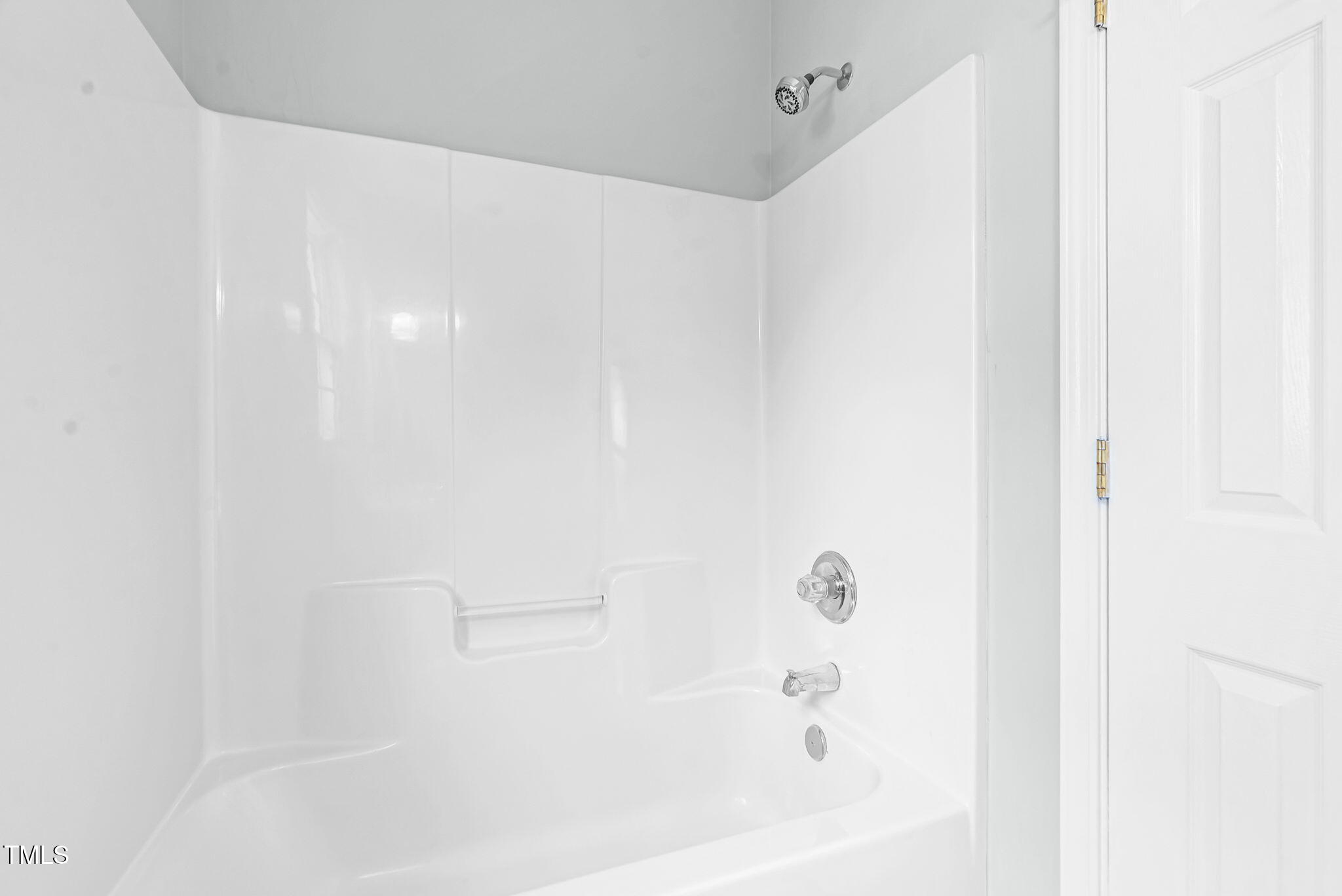 243 Toomer Loop Road Pittsboro, NC 27312 - Photo 35 of 42 a bathroom with a bathtub