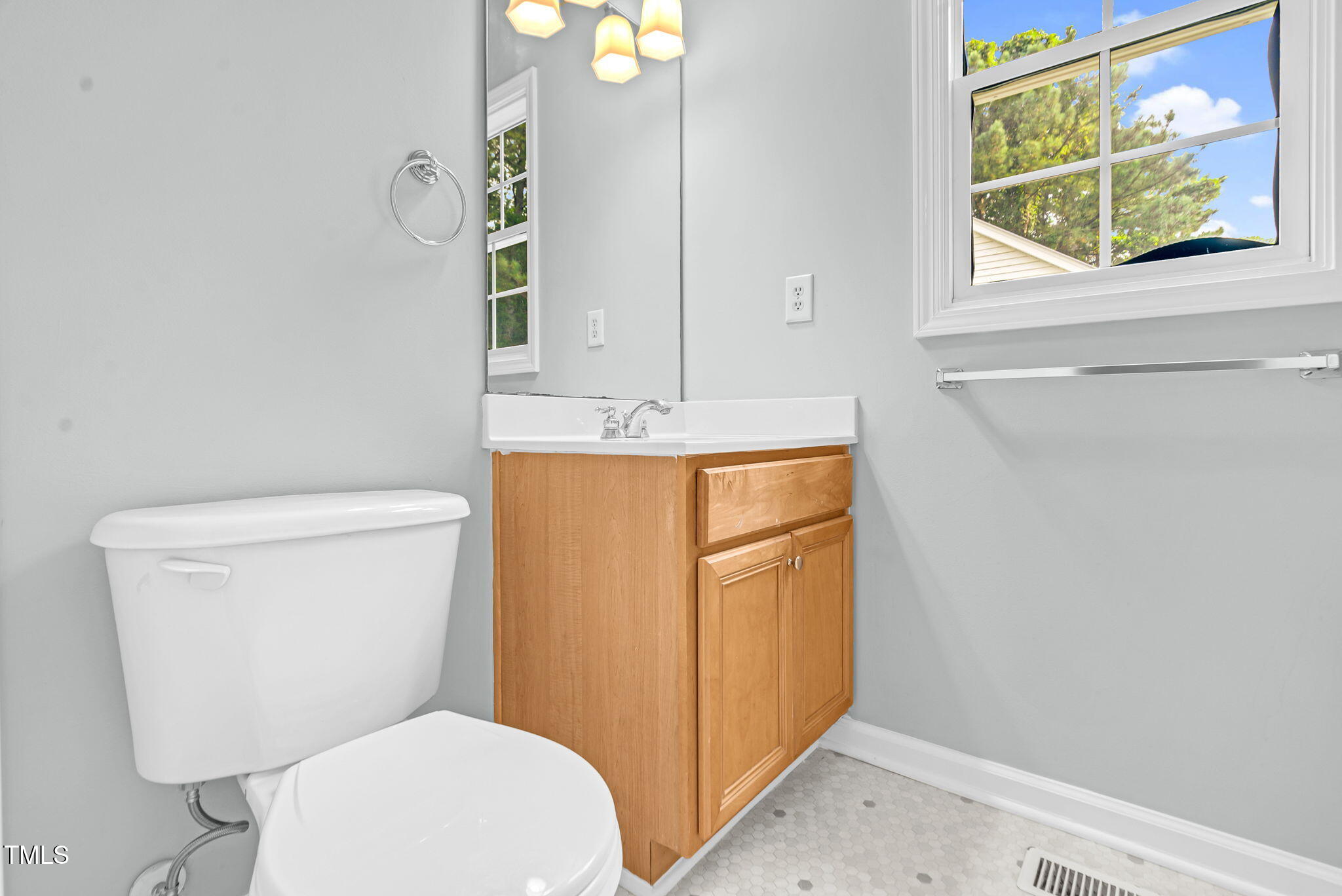 243 Toomer Loop Road Pittsboro, NC 27312 - Photo 36 of 42 a bathroom with a toilet sink and mirror