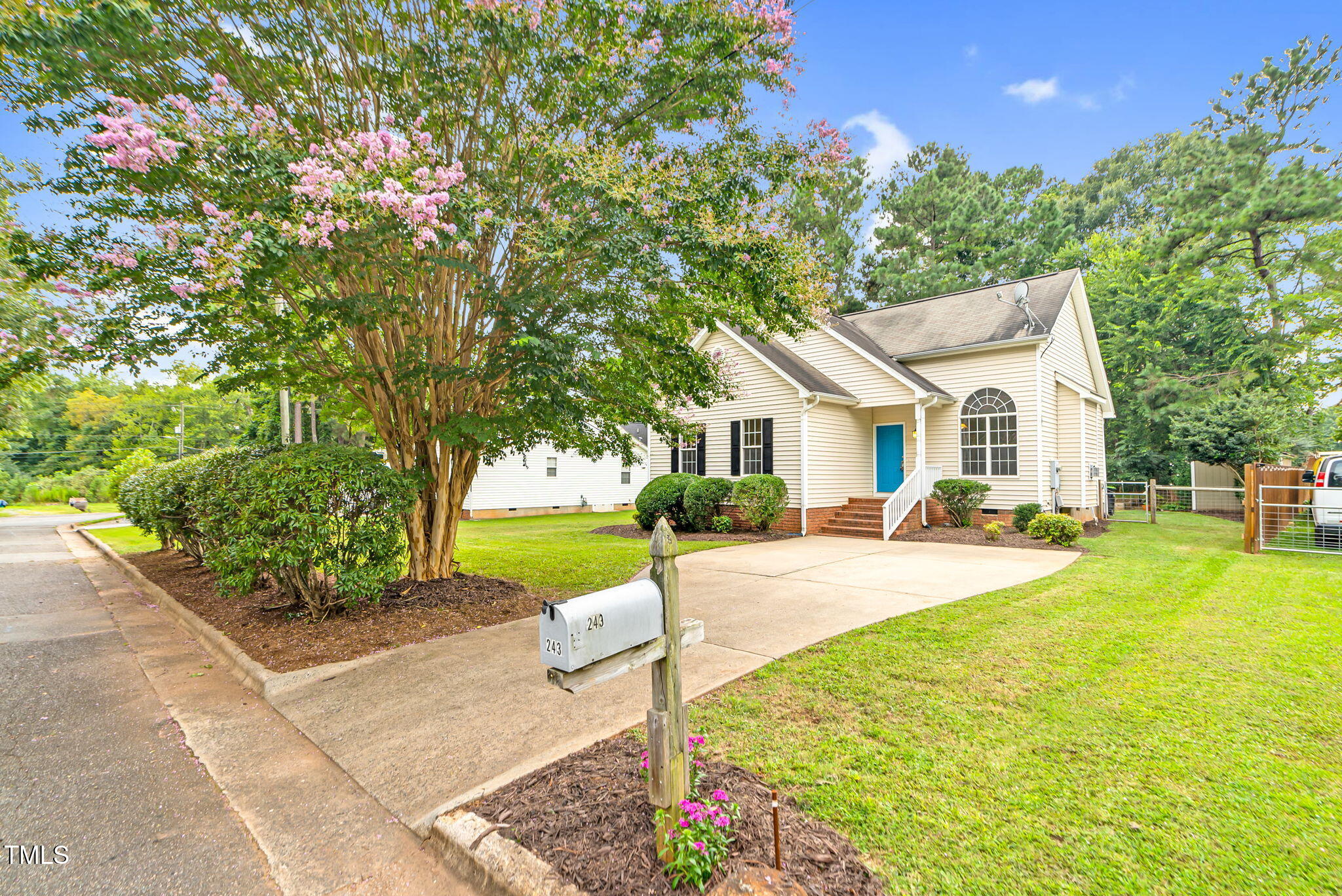 243 Toomer Loop Road Pittsboro, NC 27312 - Photo 38 of 42 a front view of a house with yard and green space