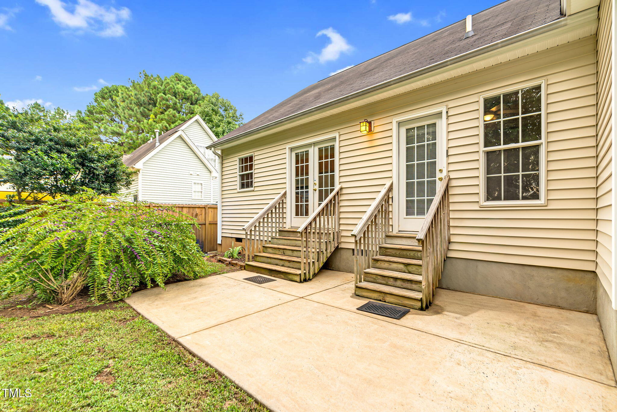 243 Toomer Loop Road Pittsboro, NC 27312 - Photo 6 of 42 a front view of a house with a garden