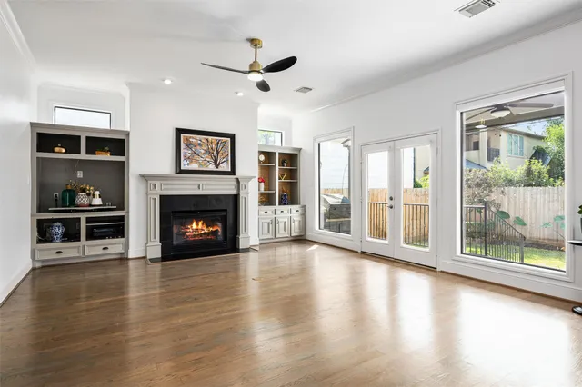 a view of a dining room with furniture wooden floor and chandelier