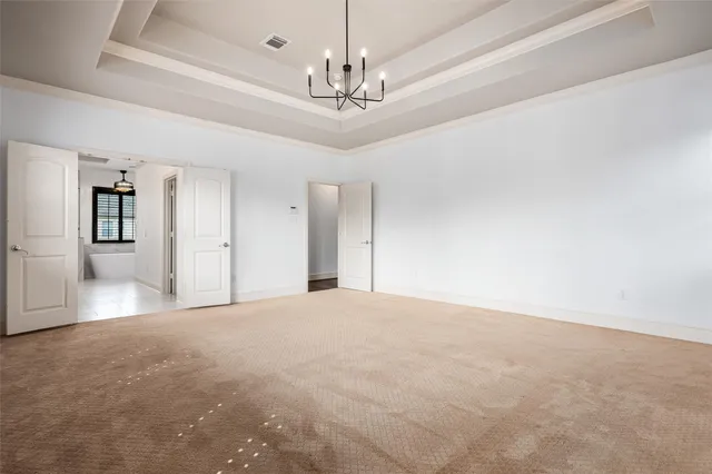 a view of an empty room with windows