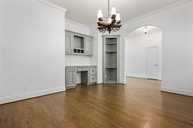 a view of a kitchen with a sink and dishwasher wooden floor