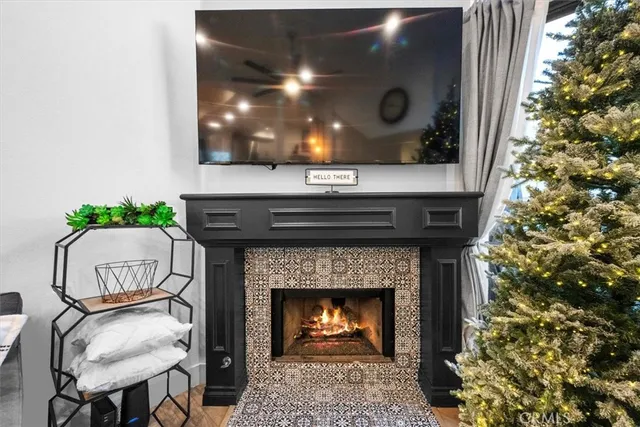 a living room with furniture and a wall painting