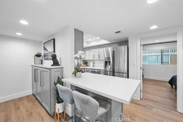 a bed room with a bed mirror and couch