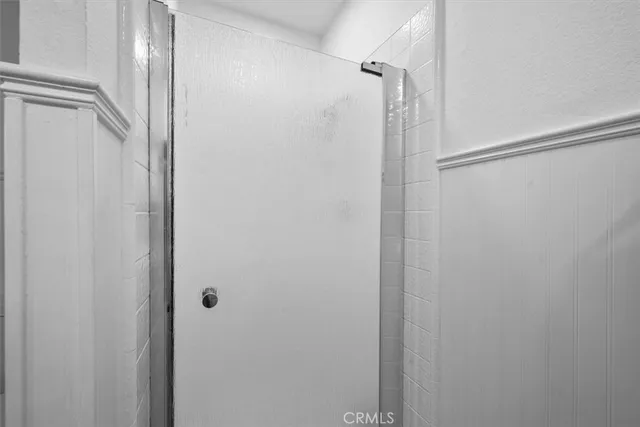 a bathroom with a shower and a sink