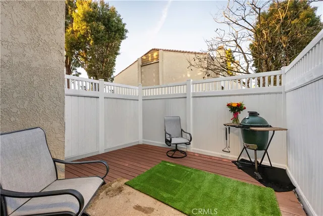 a picture of a room with a white wall and a large window