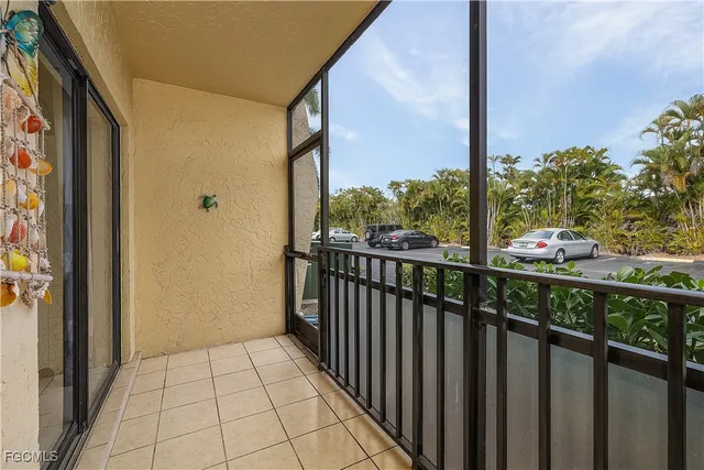 a swimming pool with outdoor seating and yard