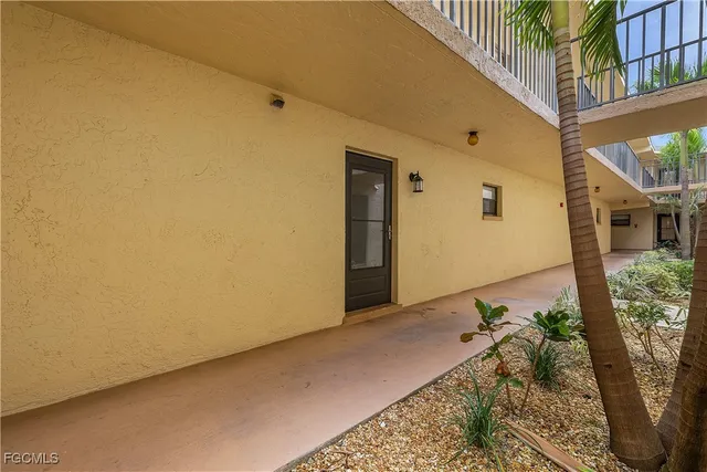 a bedroom with a bed and ceiling fan