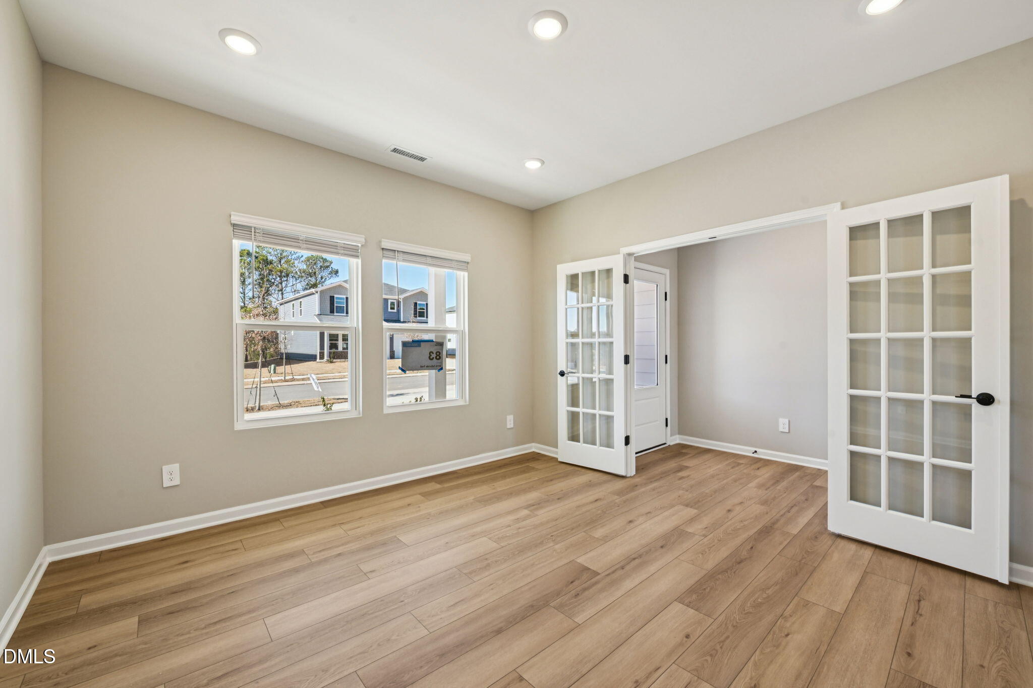 3516 Telluride Trail Raleigh, NC 27616 - Photo 11 of 47 an empty room with wooden floor and windows