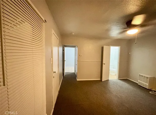 a view of hallway with livingroom