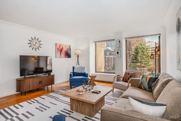 a bedroom with a bed and a couch