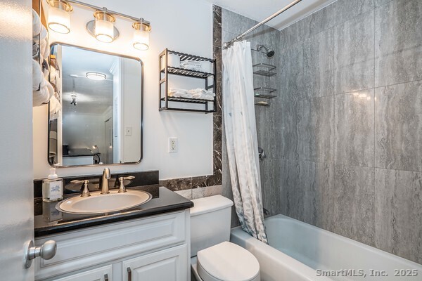 1 Gold Street, Unit 3D Hartford, CT 06103 - Photo 20 of 25 a bathroom with a granite countertop sink toilet and shower