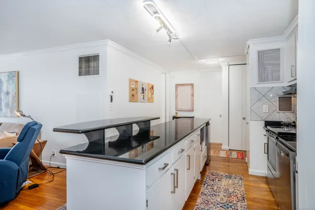 a kitchen that has a sink and a stove
