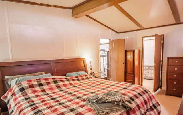 a bedroom with a bed and a cabinets