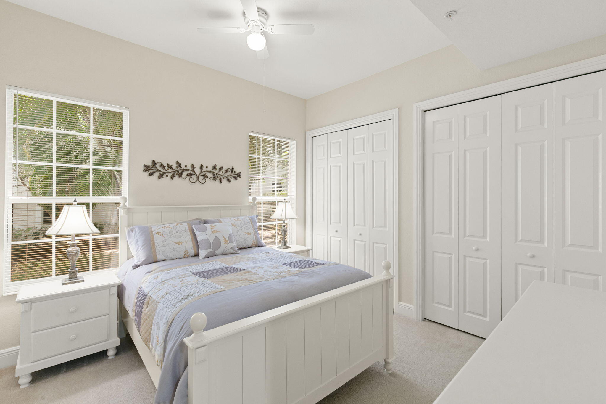 9066 Cascada Way, Unit 101 Naples, FL 34114 - Photo 23 of 51 a bedroom with a large bed and a window