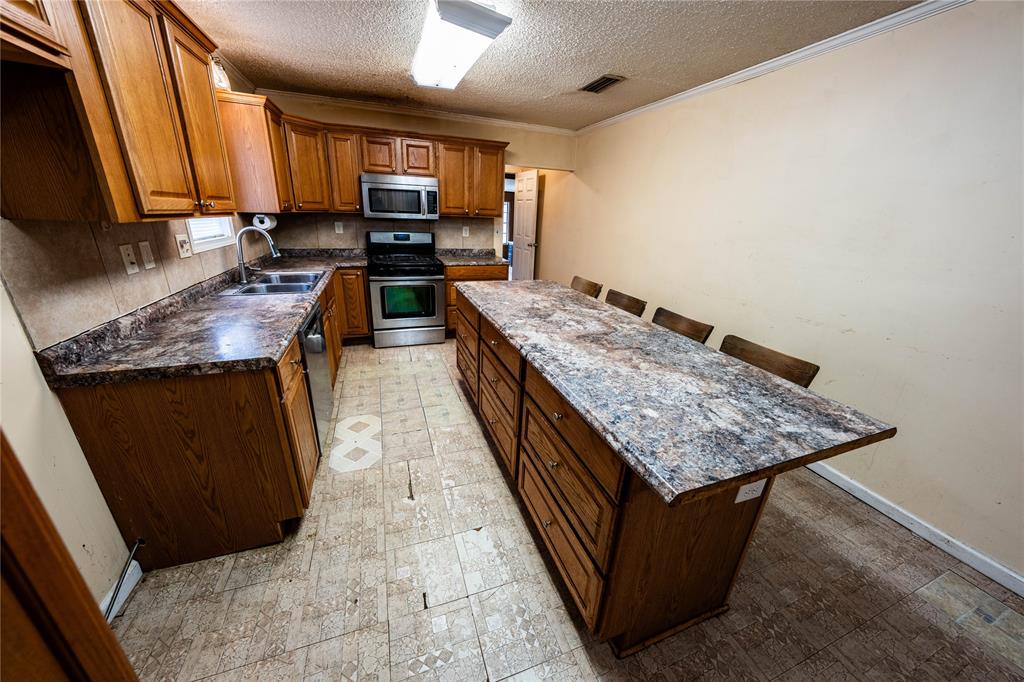7341 Broadacres Road Shreveport, LA 71129 - Photo 12 of 23 a kitchen with sink and cabinets
