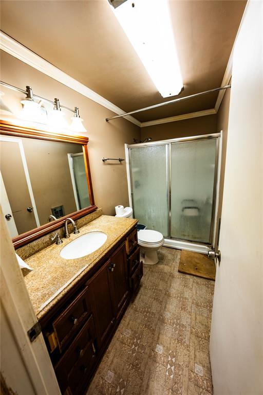 7341 Broadacres Road Shreveport, LA 71129 - Photo 7 of 23 a bathroom with a granite countertop sink toilet and shower