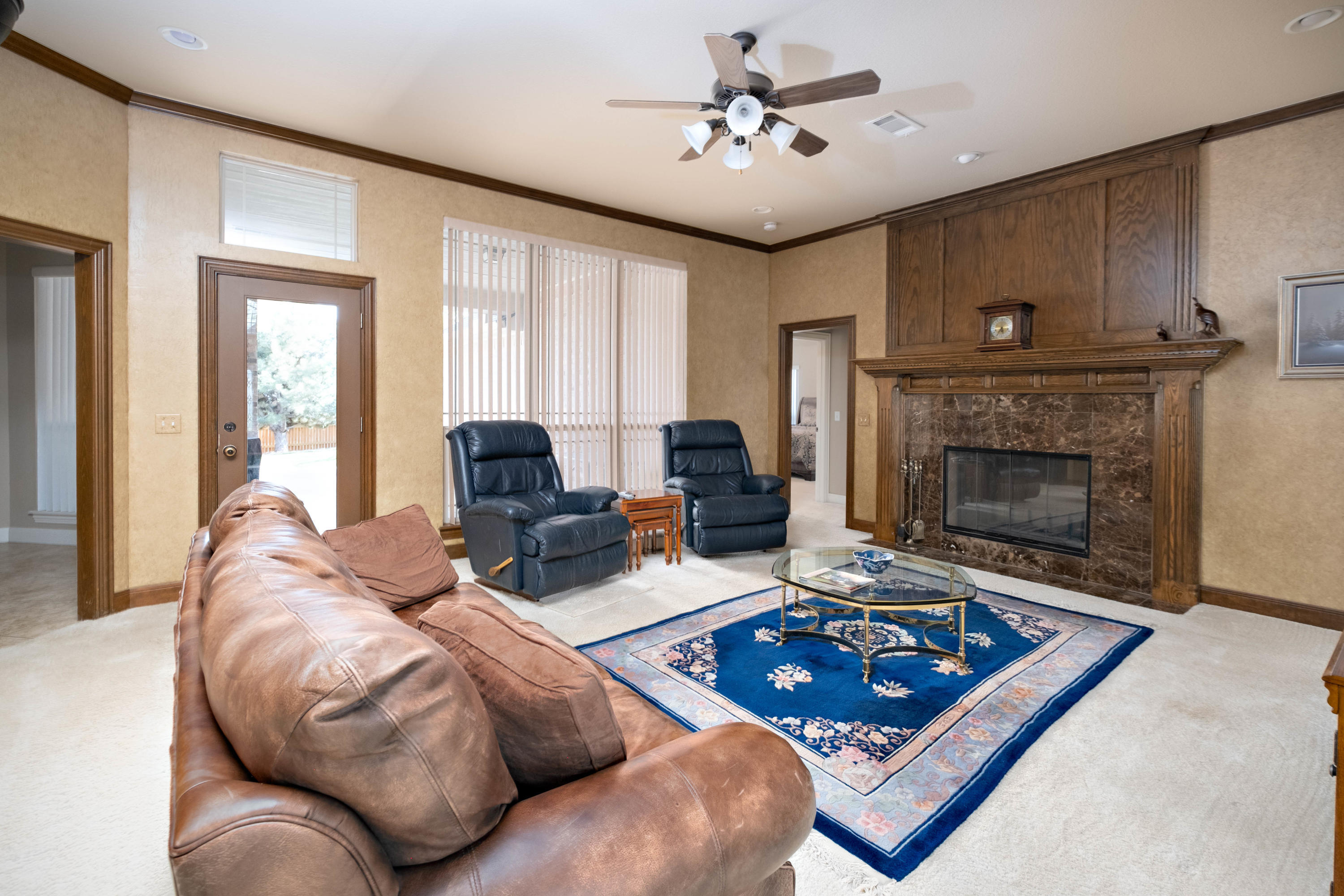 6607 Sumac Place Amarillo, TX 79124 - Photo 12 of 32 a living room with furniture and a fireplace