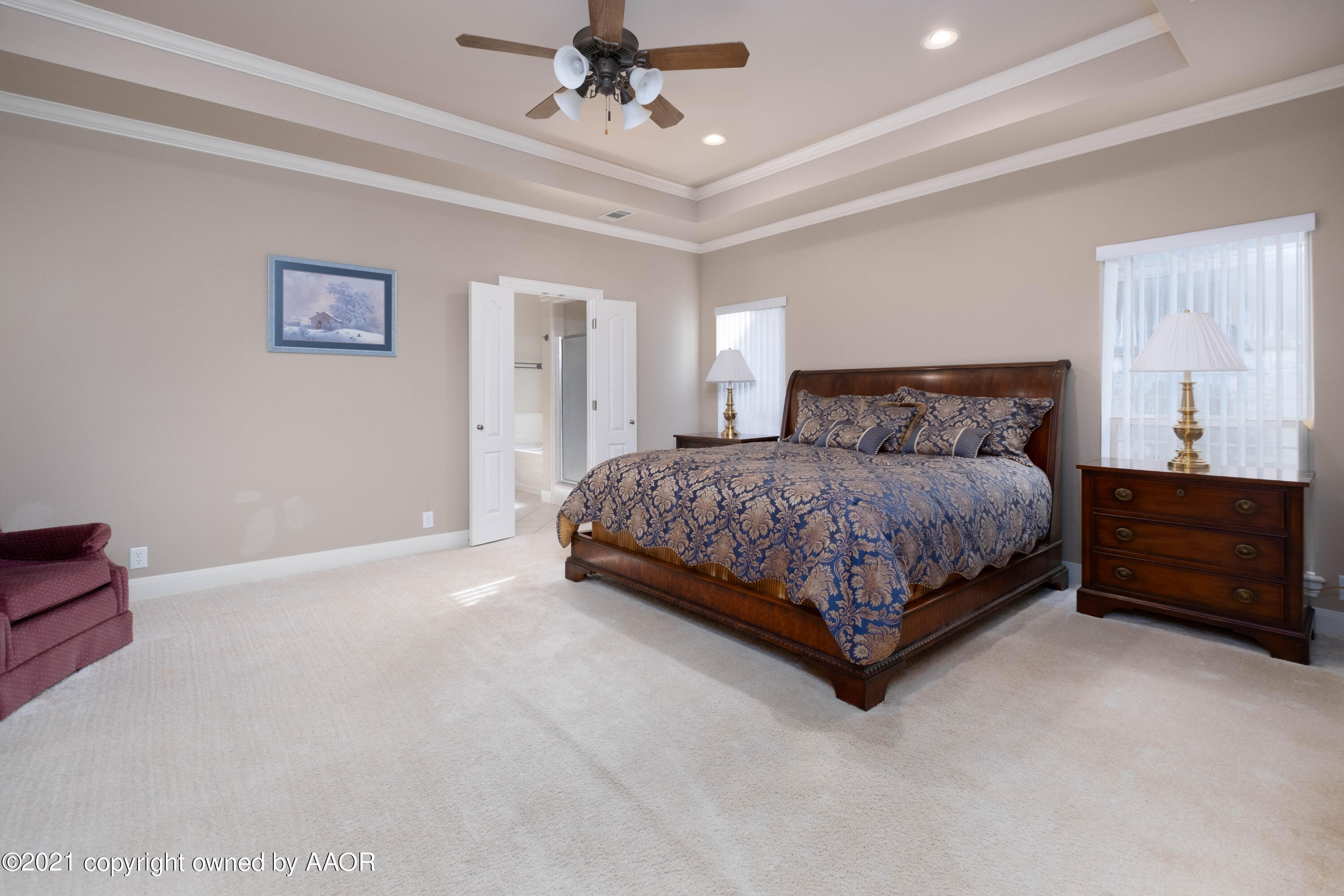 6607 Sumac Place Amarillo, TX 79124 - Photo 14 of 32 a bedroom with a bed chandelier and a window