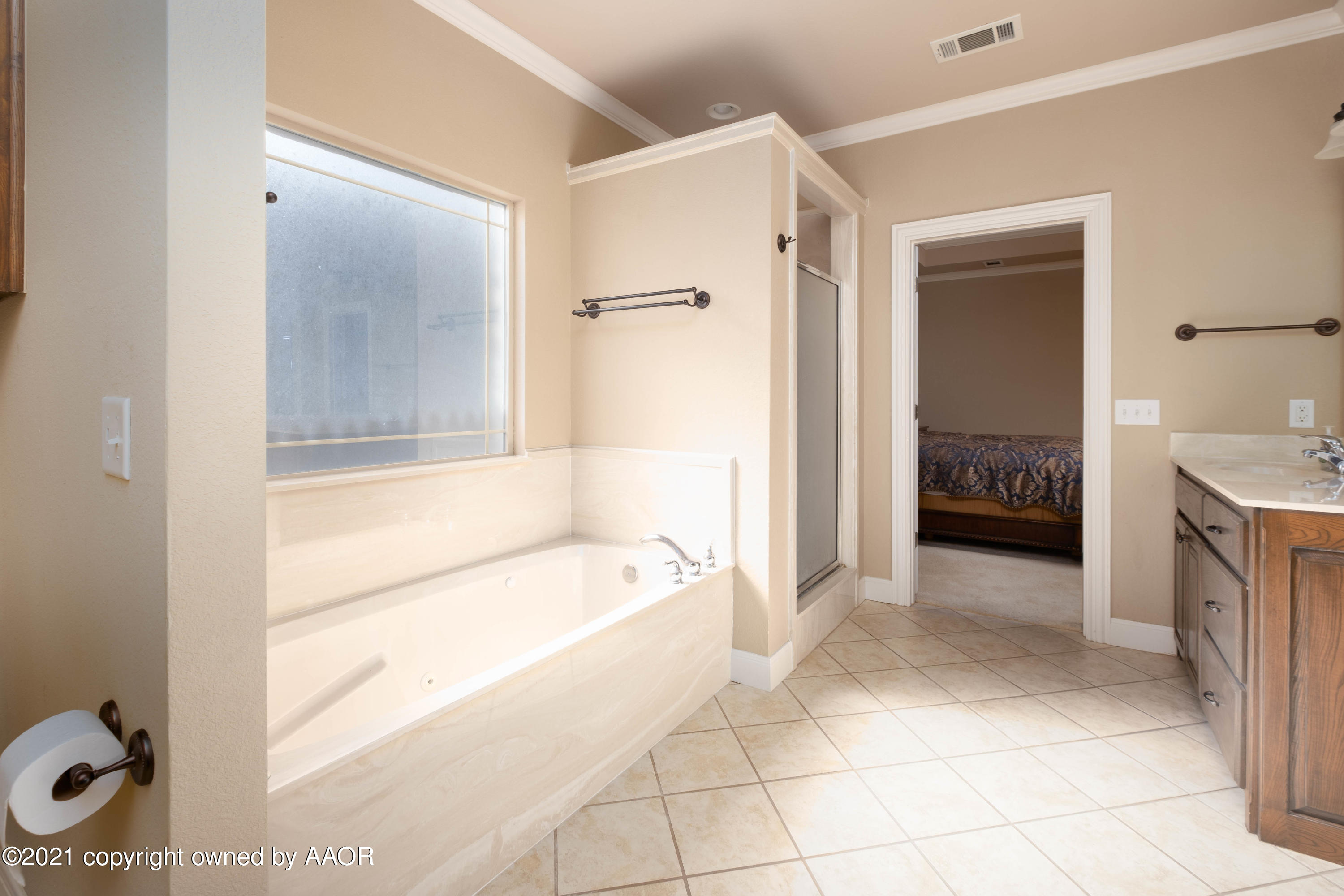 6607 Sumac Place Amarillo, TX 79124 - Photo 17 of 32 a spacious bathroom with a tub shower and a sink
