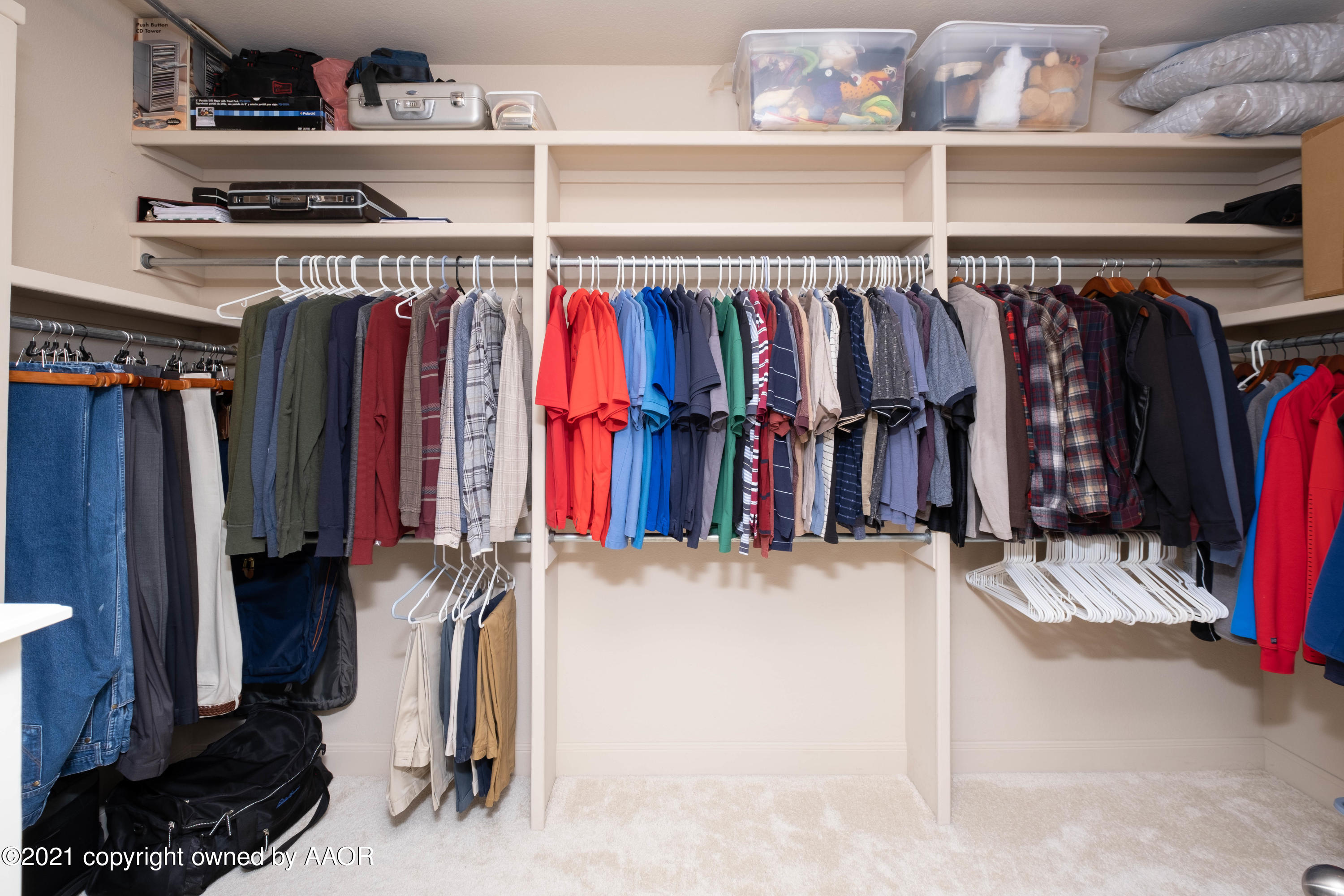 6607 Sumac Place Amarillo, TX 79124 - Photo 18 of 32 a view of walk in closet with clothes and shoes