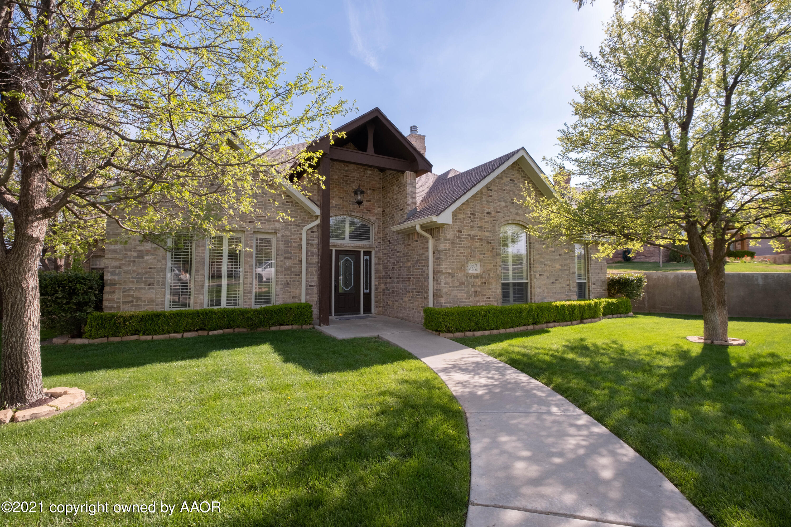 6607 Sumac Place Amarillo, TX 79124 - Photo 3 of 32 a front view of a house with a yard