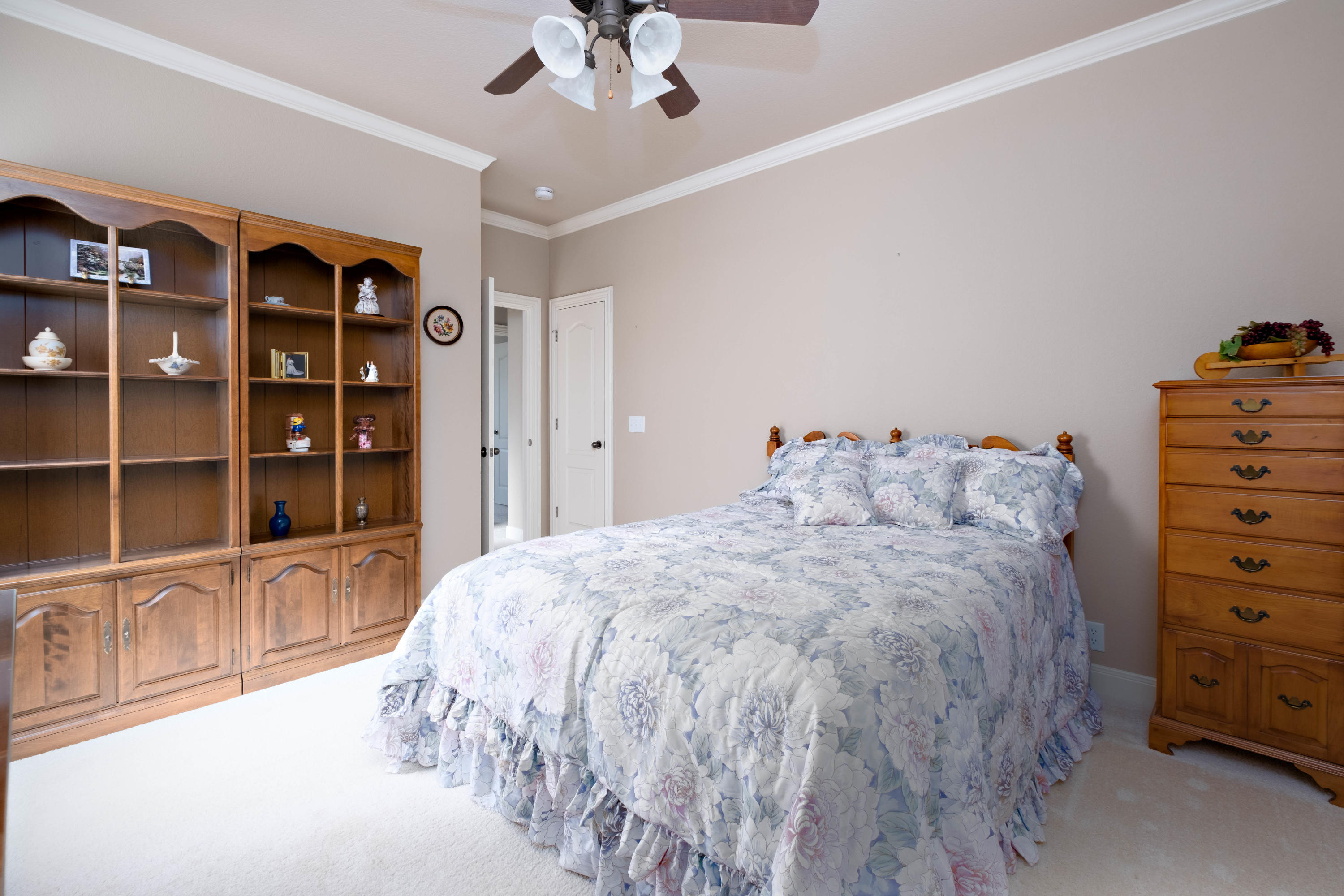 6607 Sumac Place Amarillo, TX 79124 - Photo 25 of 32 a bedroom with a bed closet and flat tv screen
